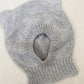 Grey bear-ear hood laid flat to show its shape