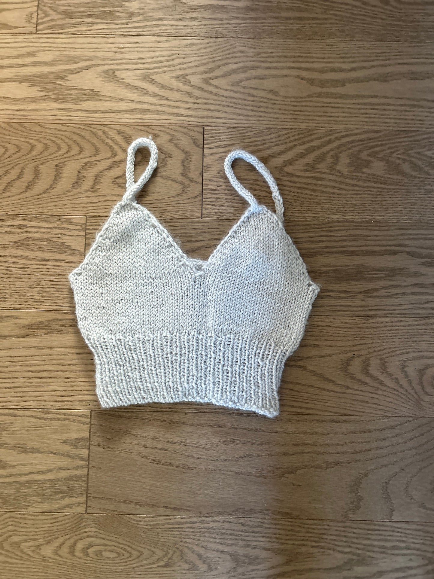 Cream knitted camisole laid flat